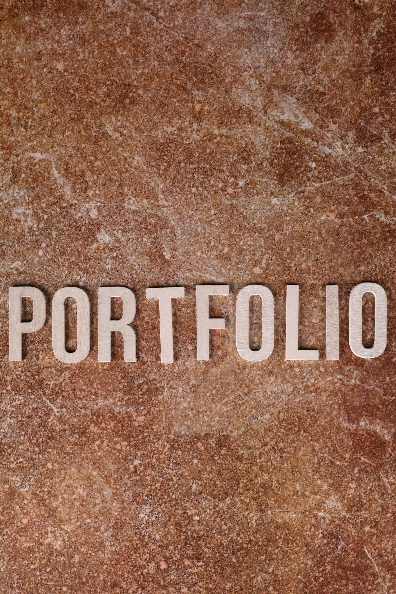 Portfolio text on a textured stone background, perfect for business themes.